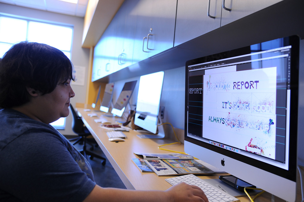 Lorena Hernandez touching up her Typography assignment in the Think Tank located in Bay Hall.